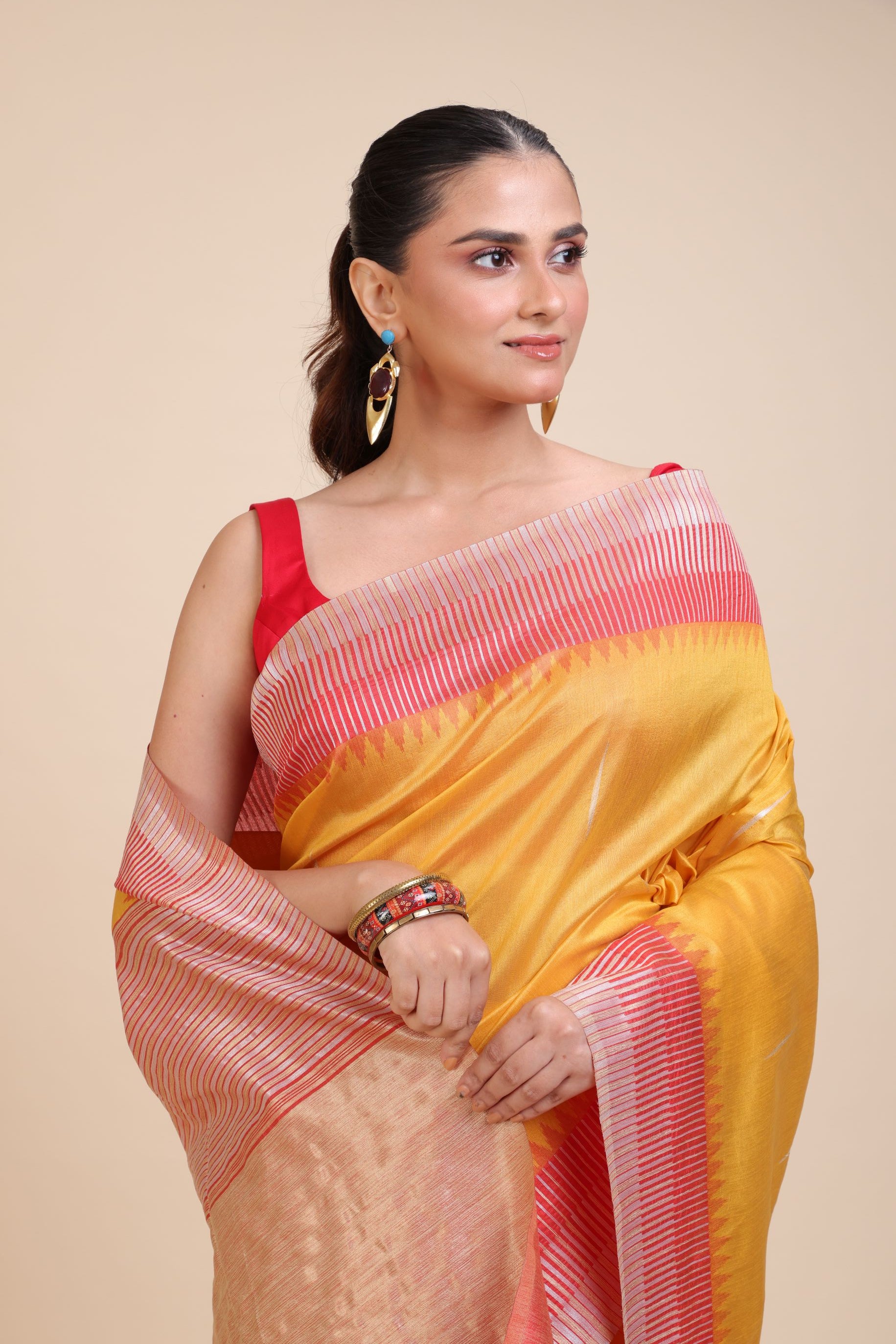 Yellow Soft Silk Saree With Red Border Close Up
