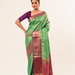 Forest Green Kanjivaram Silk Saree with Magenta Border and all over Zari - Anvi Couture