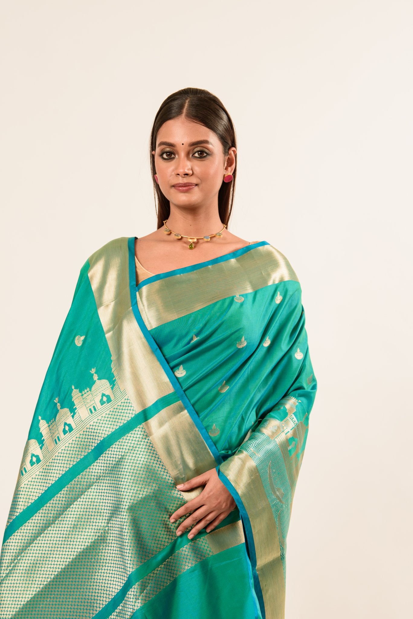 A Model wearing Traditional Katan Benarasi Silk Sari in Blue and Gold - Online Collection from Anvi Couture