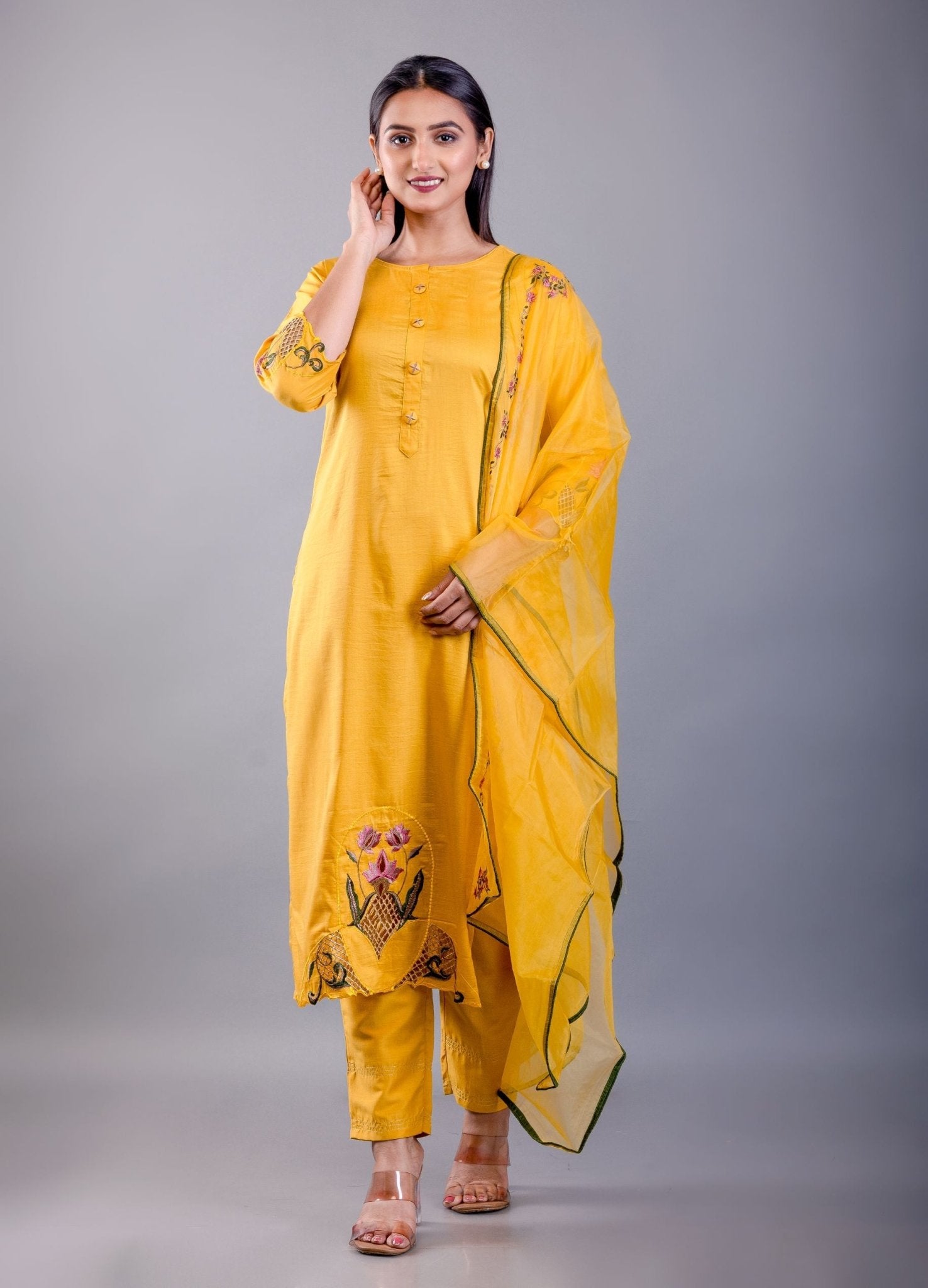 front view showing straight-cut silhouette and green embroidered yoke