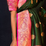 Green Katan Banarasi Silk Saree Embellished with Golden Floral Motifs and Pink Border - Anvi Couture