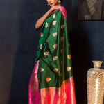 Green Katan Banarasi Silk Saree Embellished with Golden Floral Motifs and Pink Border - Anvi Couture