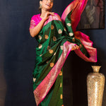 Green Katan Banarasi Silk Saree Embellished with Golden Floral Motifs and Pink Border - Anvi Couture