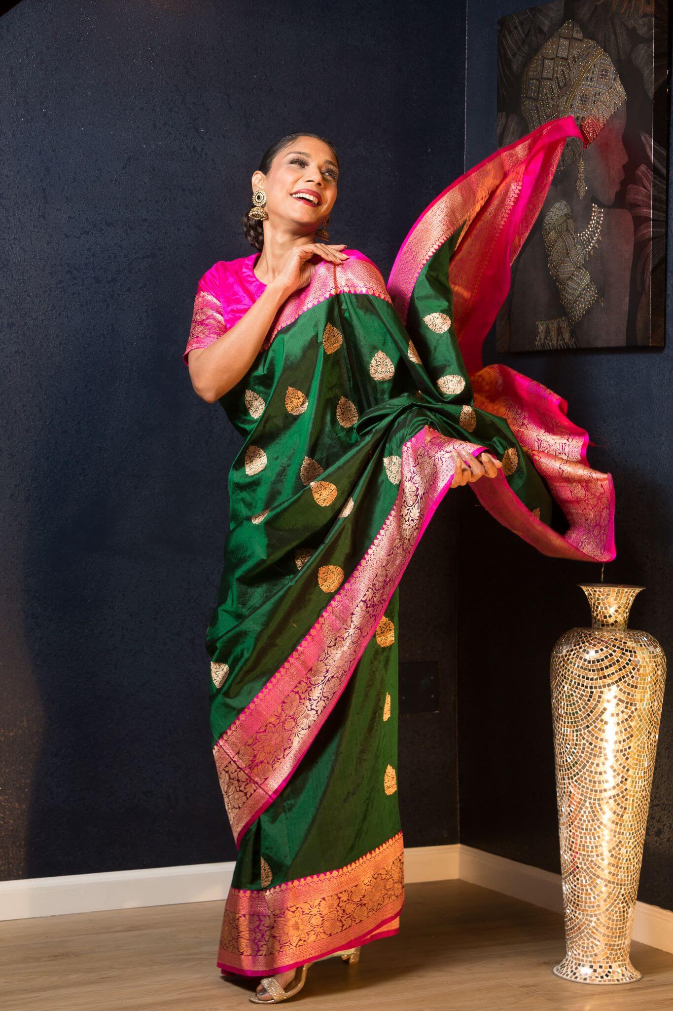 Green Katan Banarasi Silk Saree Embellished with Golden Floral Motifs and Pink Border - Anvi Couture