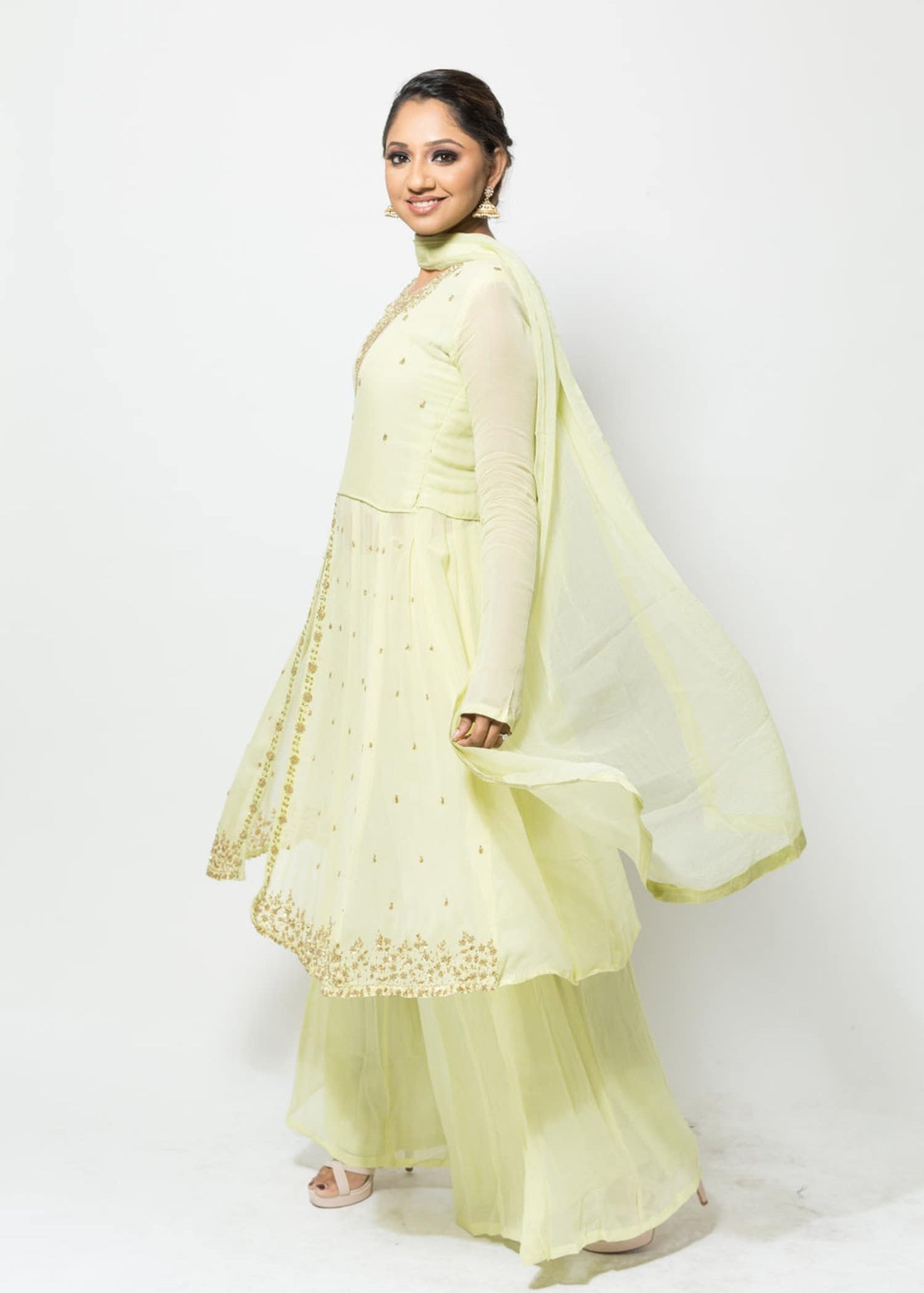 Festive light green georgette Sharara set with embroidered Kurta, round neck, and flowing design