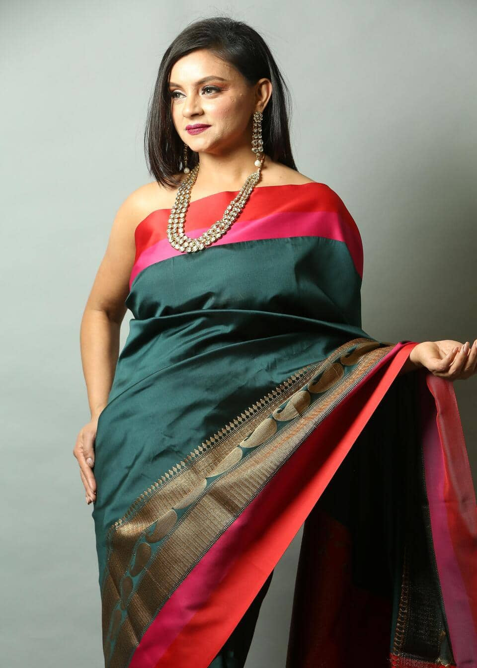 Peacock Green Silk Saree with Floral work along the Border -Close
