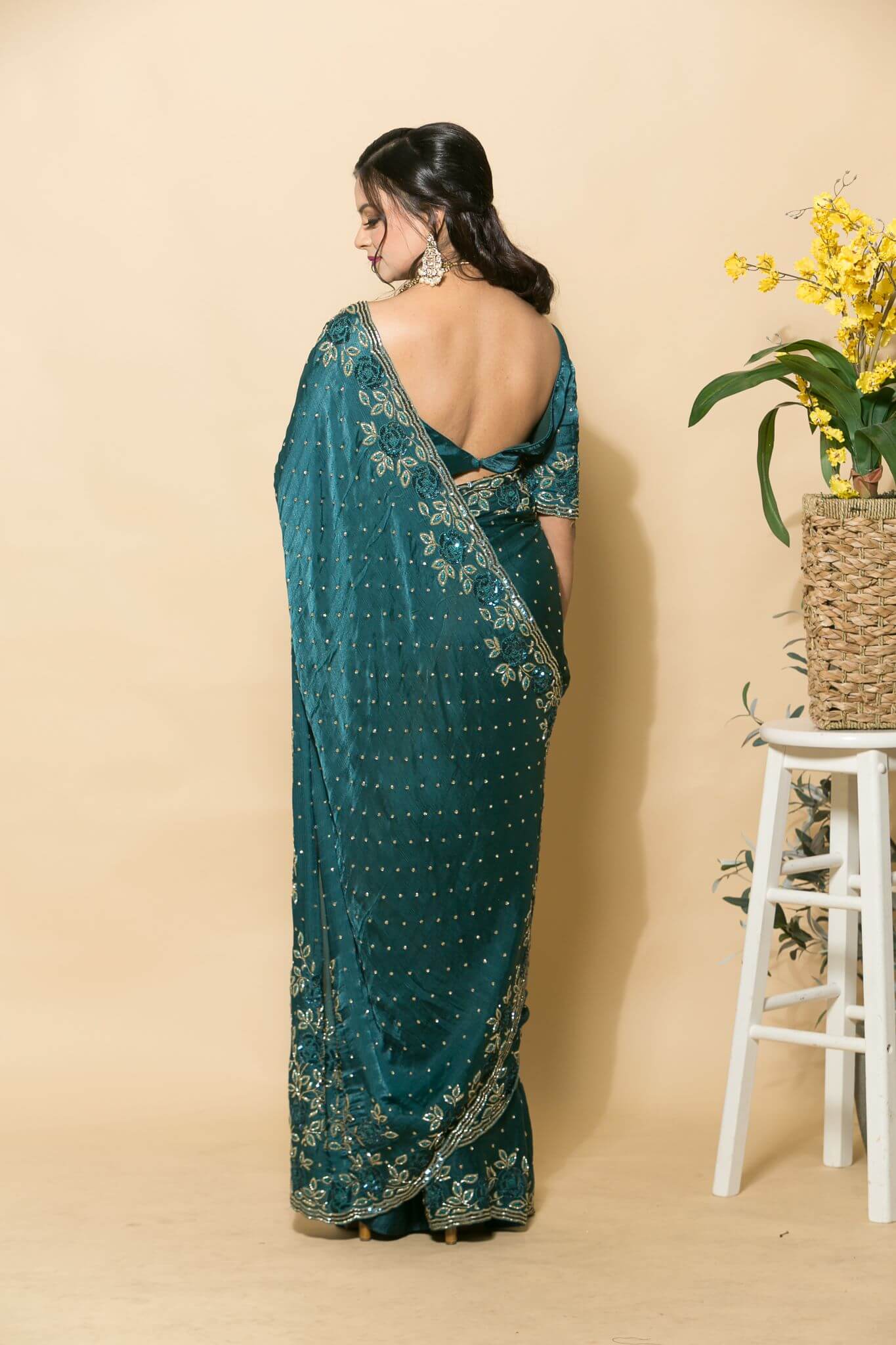 Teal Blue Crepe Saree with stonework and floral embroidery - Anvi Couture